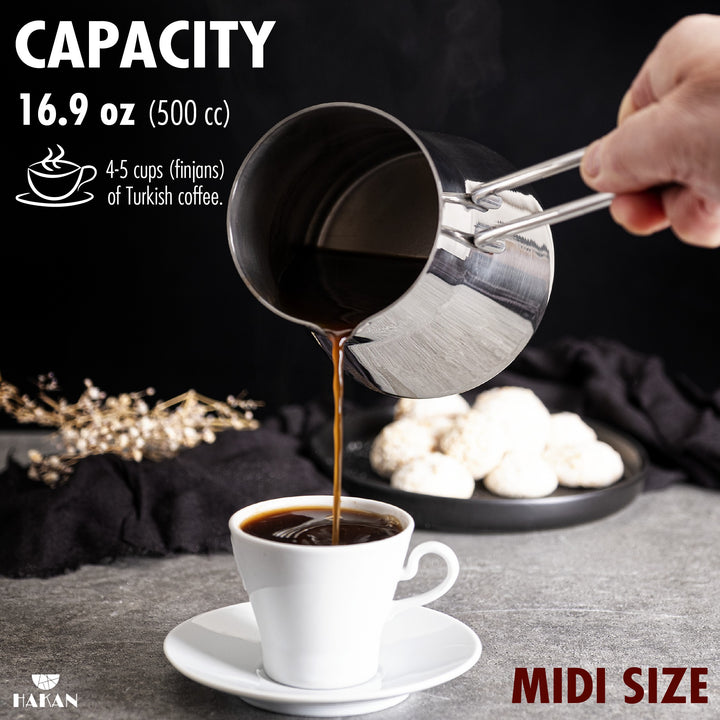 A person pours Turkish coffee from a midi-size 16.9 oz (500 cc) stainless steel pot into a white cup, suitable for 4-5 cups of Turkish coffee.