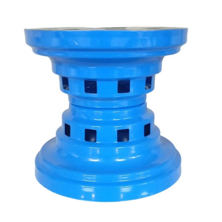 The HAKAN Ottoman Stove Osmanlı Ocagi BBQ, available in mixed colors, is a blue cylindrical item made of heat-resistant metal with a wide base and top, featuring multiple rectangular cutouts around the center. Its symmetrical design offers both functionality and an industrial aesthetic.